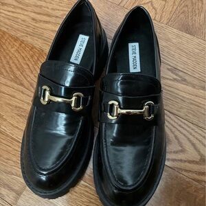 Steve Madden Glossy Black Loafers with Gold Accent